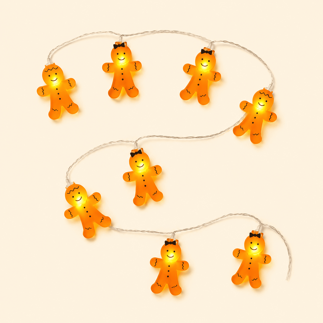 Guirlande lumineuse pain d’épices assortis sur fond beige