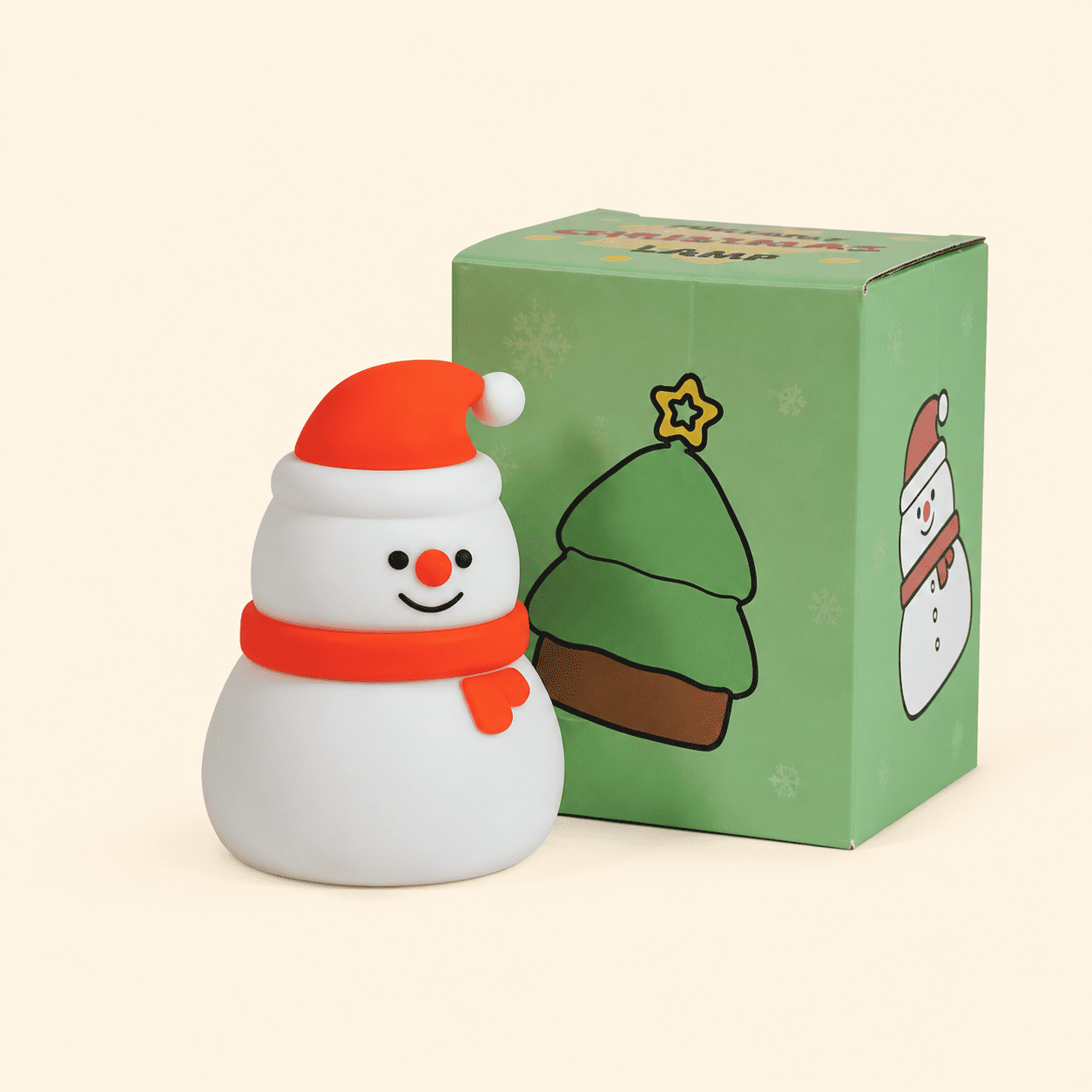 Mini veilleuse de Noël bonhomme de neige avec sa boîte sur fond beige