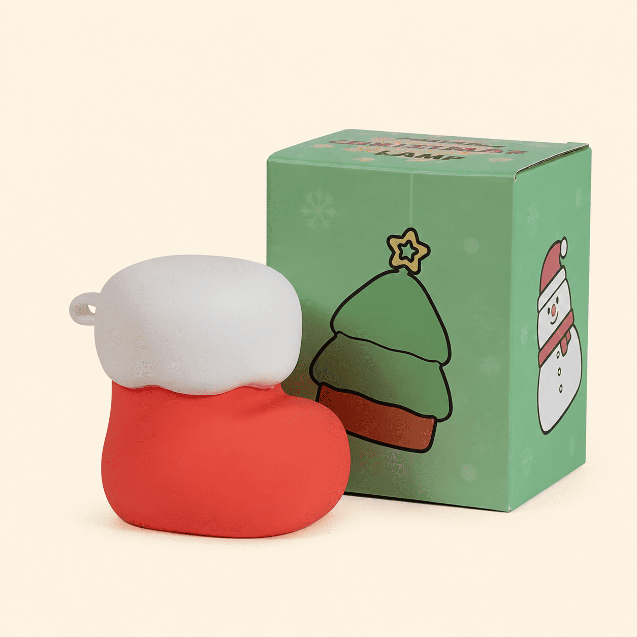 Mini veilleuse chaussette de Noël avec sa boîte sur fond beige